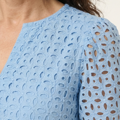 THE WHITMORE FAMILY Brielle V-neck short sleeve tiered midi dress with a flowing, layered design and midi length, shown in the image.