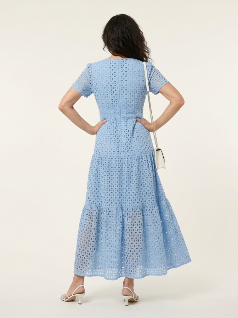 Brielle V-neck short sleeve tiered midi dress by THE WHITMORE FAMILY, with a flowing, layered skirt and fitted bodice.