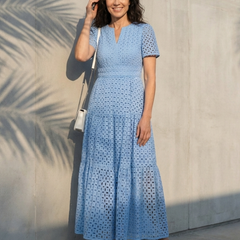 Brielle V-neck short sleeve tiered midi dress by THE WHITMORE FAMILY, featuring a flowing silhouette and tiered skirt.