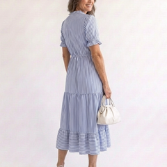 Dakota short sleeve striped tiered midi dress by THE WHITMORE FAMILY, featuring a colorful, flowing tiered design and short sleeves.