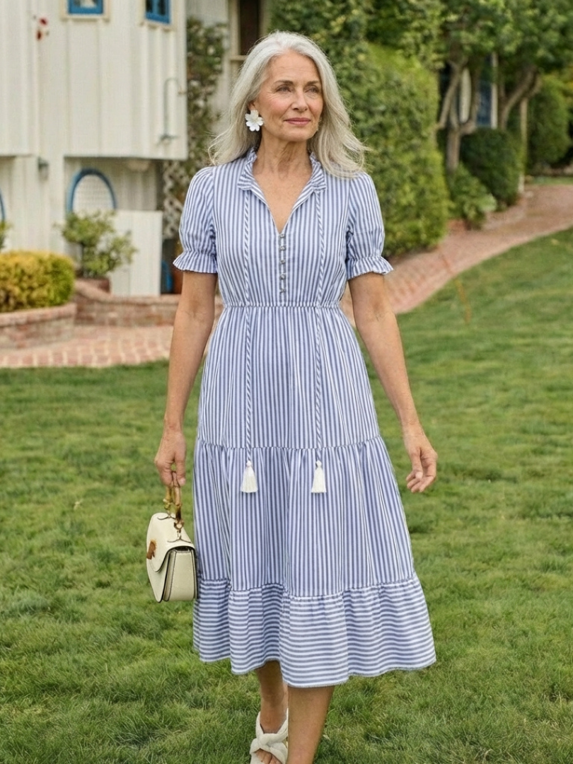 Striped tiered midi dress from THE WHITMORE FAMILY featuring short sleeves and a stylish, flowing design.