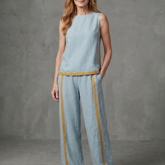 Sky-blue sleeveless top and wide-leg contrast pants set by THE WHITMORE FAMILY, stylish and comfortable fashion ensemble.