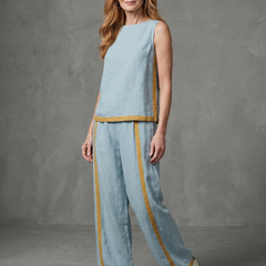 Sky blue sleeveless top and wide-leg contrast pants set by THE WHITMORE FAMILY, stylish and comfortable women's outfit.