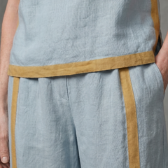Sky blue sleeveless top and wide-leg contrast pants set by THE WHITMORE FAMILY, stylish and comfortable women's apparel.