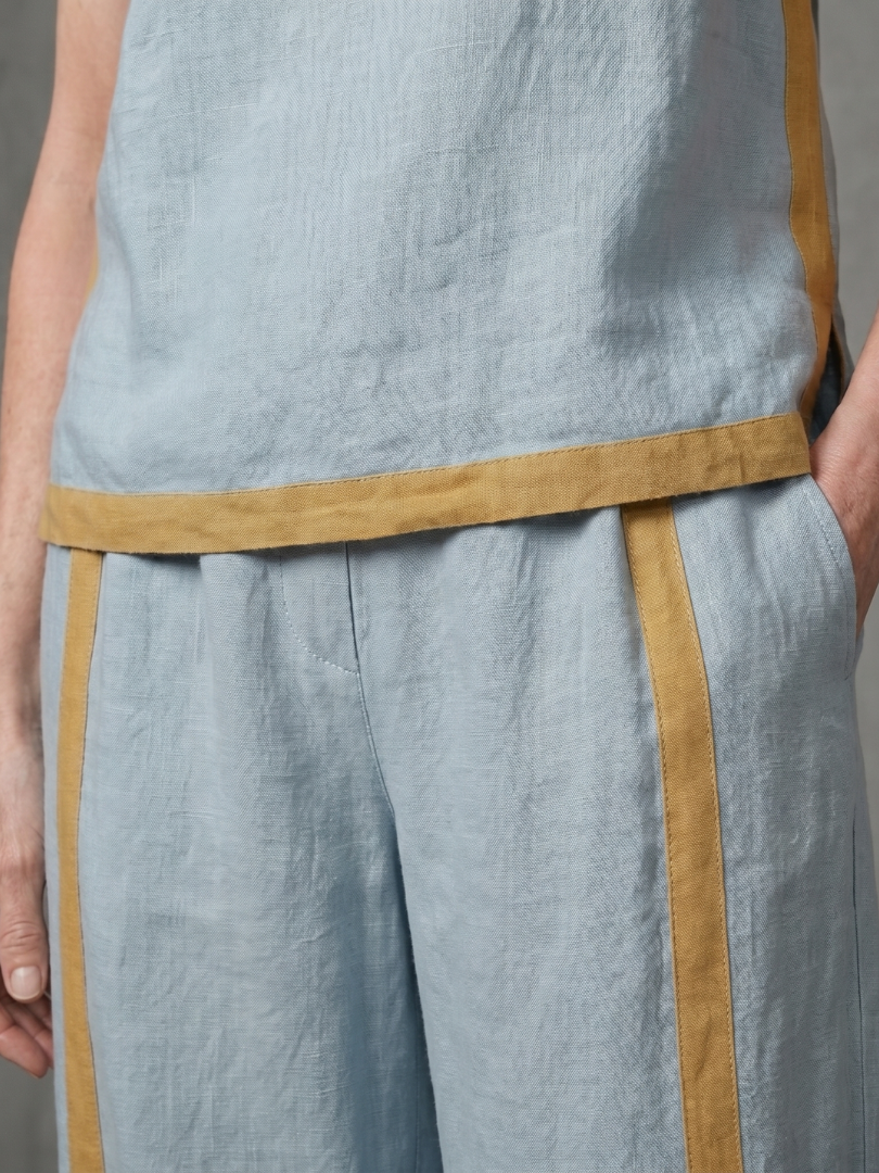 Sky blue sleeveless top and wide-leg contrast pants set by THE WHITMORE FAMILY, stylish and comfortable women's apparel.