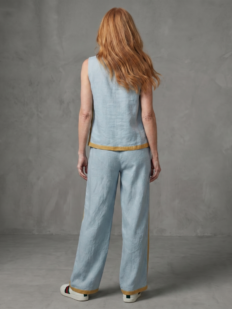 Sky blue sleeveless top and wide-leg contrast pants set by THE WHITMORE FAMILY, stylish and comfortable women's clothing ensemble.