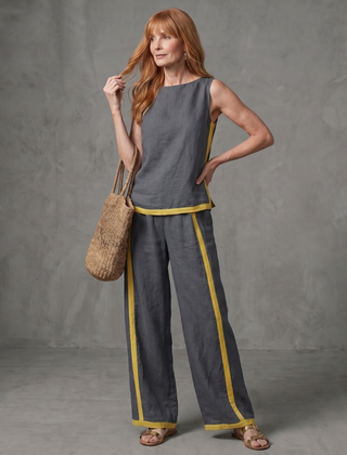 Sky blue sleeveless top and wide-leg contrast pants set by THE WHITMORE FAMILY, stylish and comfortable casual outfit.