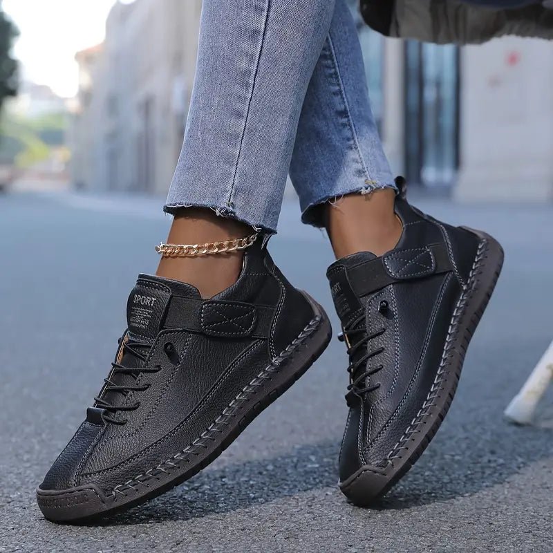 Black Lily™ ergonomic support sneakers by THE WHITMORE FAMILY featuring cushioned insoles and breathable mesh for comfortable walking.