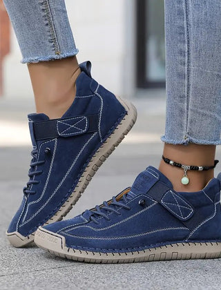 Blue Chloé™ ergonomic support sneakers by THE WHITMORE FAMILY, showcasing cushioned design and comfortable athletic style.