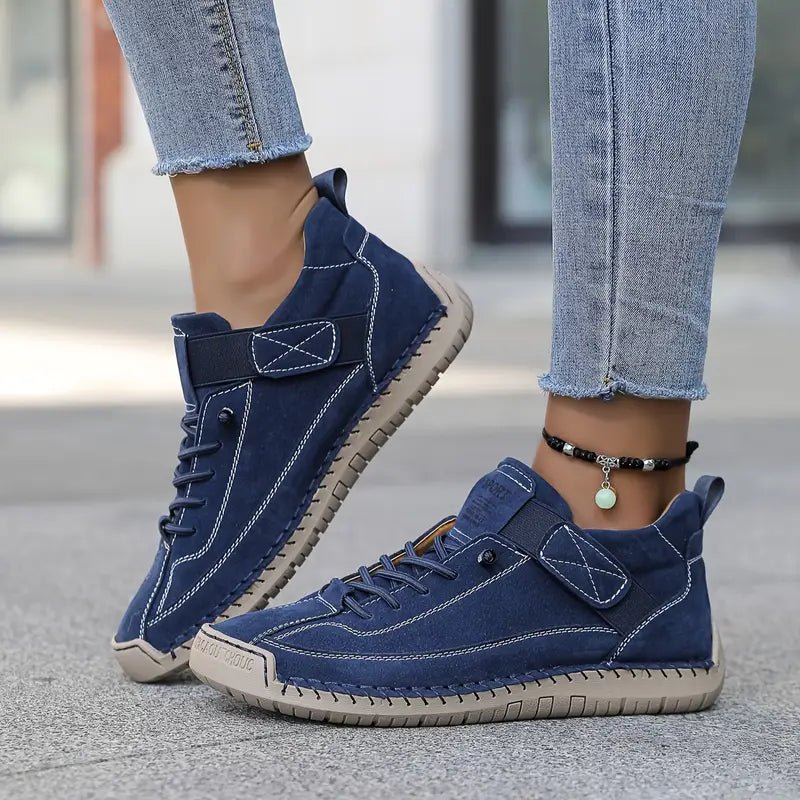 Blue Chloé™ ergonomic support sneakers by THE WHITMORE FAMILY, showcasing cushioned design and comfortable athletic style.