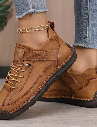 Brown Nina™ ergonomic support sneakers by THE WHITMORE FAMILY, showing the stylish, cushioned design and comfortable fit.
