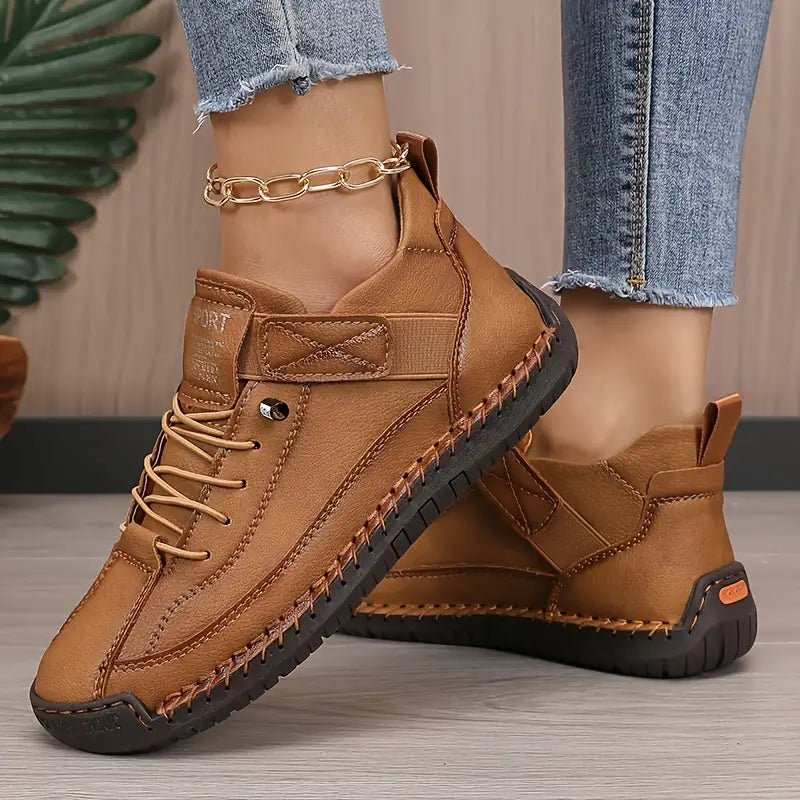 Brown Nina™ ergonomic support sneakers by THE WHITMORE FAMILY, showing the stylish, cushioned design and comfortable fit.