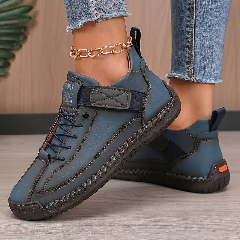 Dark blue Inès™ ergonomic support sneakers by THE WHITMORE FAMILY, featuring cushioned insoles and supportive design for comfort.