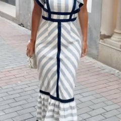 Dianne retro striped maxi dress by THE WHITMORE FAMILY featuring bold vertical stripes and a flowing silhouette.
