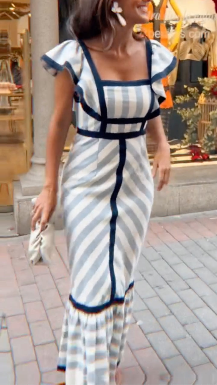 Dianne retro striped maxi dress by THE WHITMORE FAMILY, featuring bold vertical stripes and a flowing silhouette.