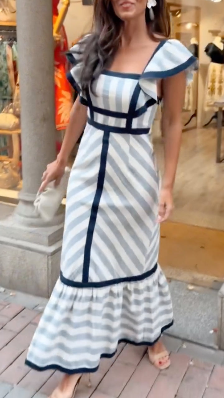 Dianne retro striped maxi dress by THE WHITMORE FAMILY, featuring colorful vertical stripes and a flowing silhouette.
