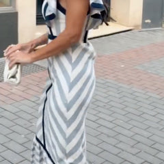 Dianne retro striped maxi dress by THE WHITMORE FAMILY, featuring colorful horizontal stripes and a flowing, elegant design.