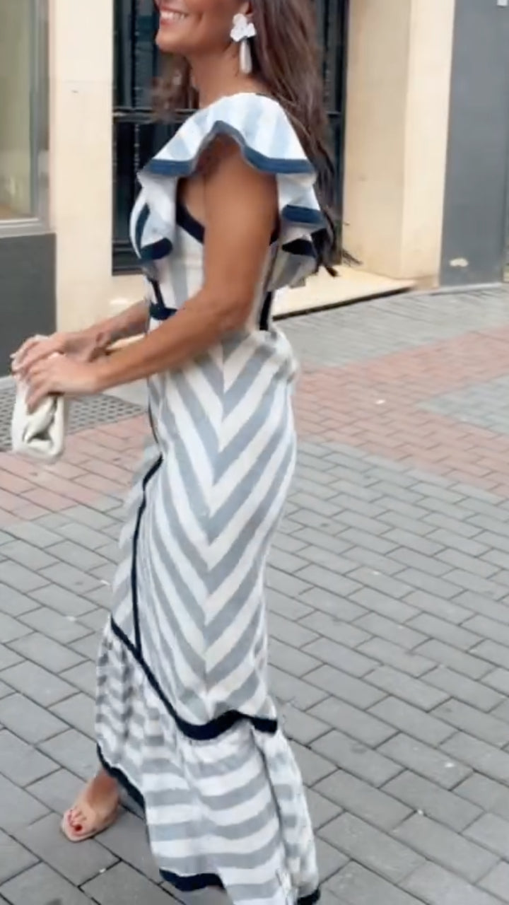 Dianne retro striped maxi dress by THE WHITMORE FAMILY, featuring colorful horizontal stripes and a flowing, elegant design.