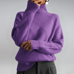 Lauren™ Luxe Turtleneck Sweater from THE WHITMORE FAMILY, soft knit, close-up of beige sweater with ribbed collar and fabric texture.