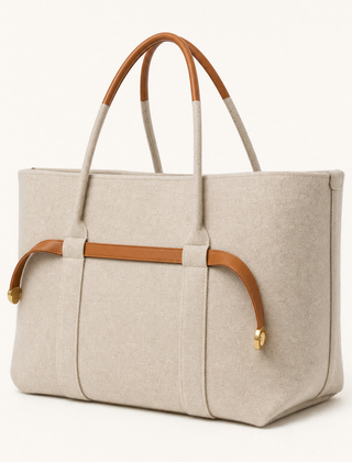 Colette Wool Tote by THE WHITMORE FAMILY in caramel color, featuring a spacious tote bag with wool fabric and sturdy handles.