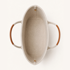 Colette Wool Tote by THE WHITMORE FAMILY in caramel with interior compartments and sturdy handles.