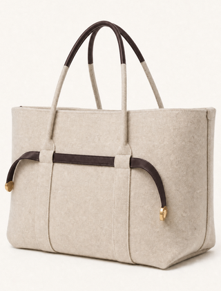 The Colette Wool Tote by THE WHITMORE FAMILY featuring a spacious espresso-colored wool tote bag with sturdy handles.