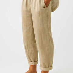 Romina™ linen-cotton trousers by THE WHITMORE FAMILY, featuring a relaxed fit and lightweight fabric, shown on a model.