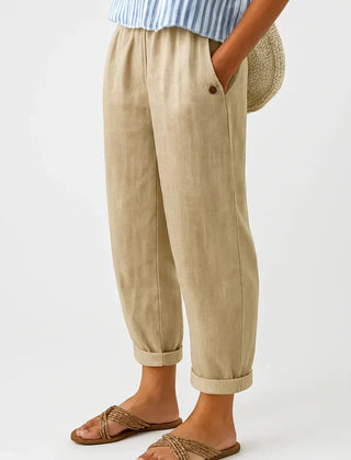 Romina™ linen-cotton trousers by THE WHITMORE FAMILY, featuring a relaxed fit and lightweight fabric, shown on a model.
