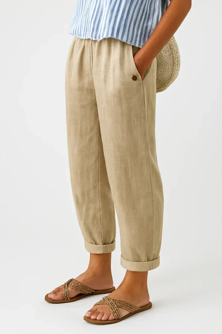 Romina™ linen-cotton trousers by THE WHITMORE FAMILY, featuring a relaxed fit and lightweight fabric, shown on a model.