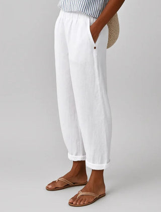 Romina™ Timeless Linen-Cotton Trouser from THE WHITMORE FAMILY, showcasing beige trousers with a relaxed fit and classic waistband.