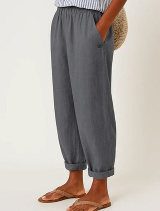 Romina™ linen-cotton trousers by THE WHITMORE FAMILY, shown in natural beige with a relaxed fit and front pockets.