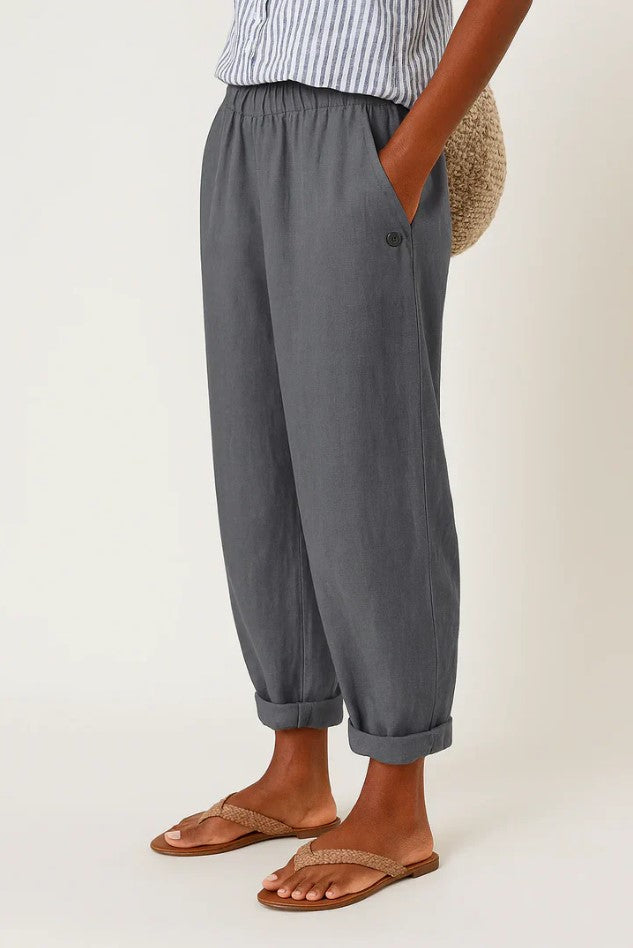 Romina™ linen-cotton trousers by THE WHITMORE FAMILY, shown in natural beige with a relaxed fit and front pockets.