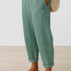 Romina™ linen-cotton trousers by THE WHITMORE FAMILY, featuring a relaxed fit and classic style in neutral fabric.