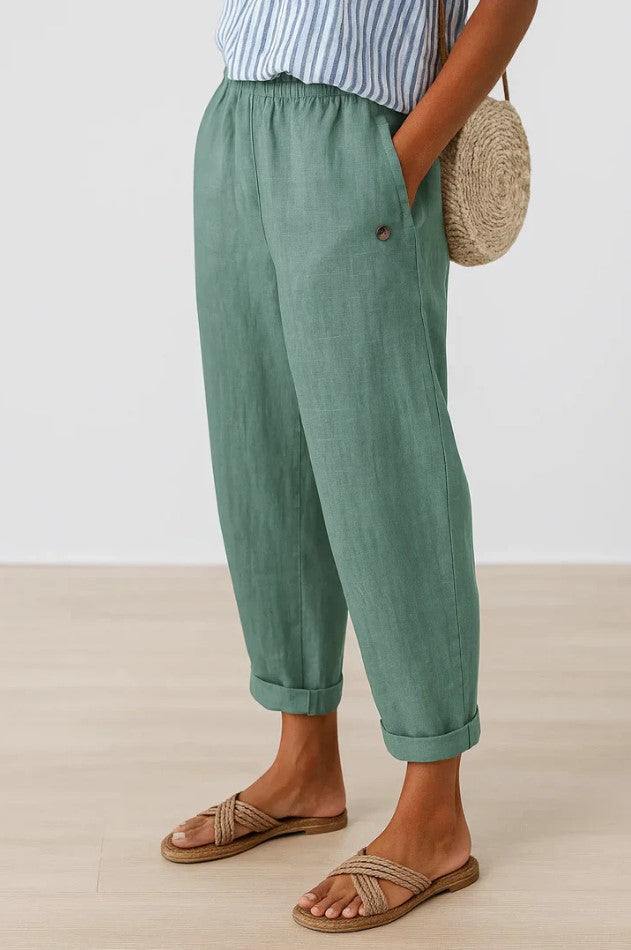 Romina™ linen-cotton trousers by THE WHITMORE FAMILY, featuring a relaxed fit and classic style in neutral fabric.