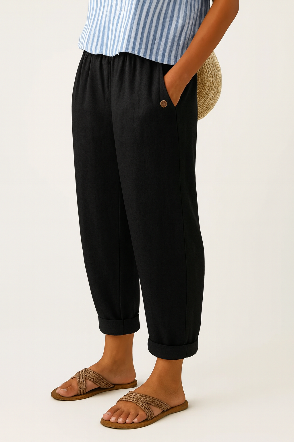Sharona black linen-cotton trousers from THE WHITMORE FAMILY with a relaxed fit and tailored design, displayed on a neutral background.