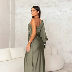 Turquoise Riley one-shoulder evening maxi dress by THE WHITMORE FAMILY, flowing fabric and elegant design for formal occasions.