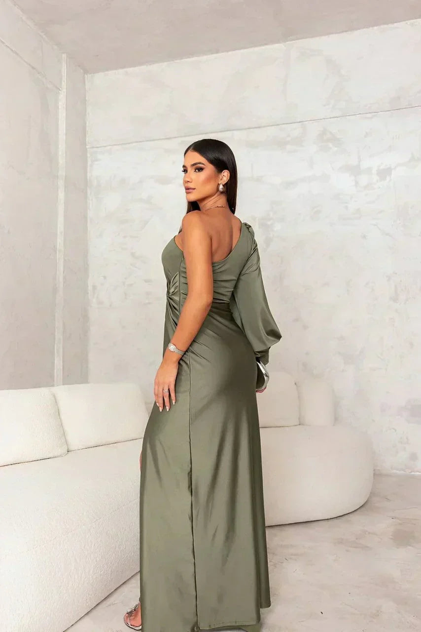 Turquoise Riley one-shoulder evening maxi dress by THE WHITMORE FAMILY, flowing fabric and elegant design for formal occasions.