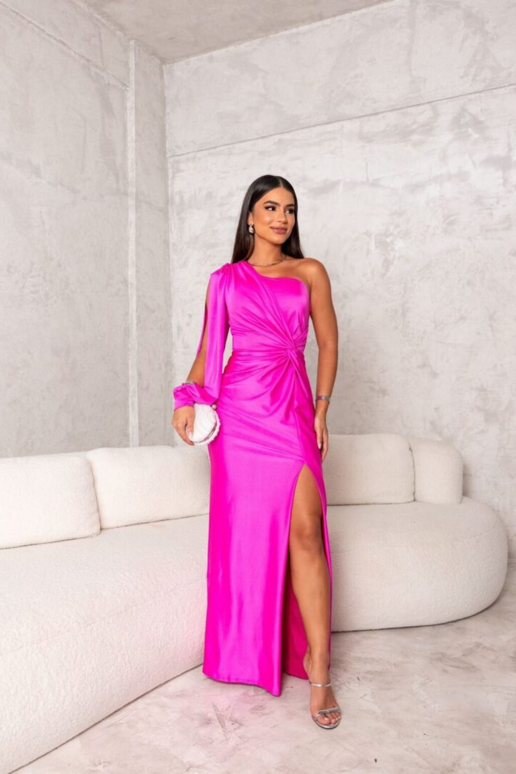 Turquoise Riley one-shoulder evening maxi dress by THE WHITMORE FAMILY displayed on a model. Elegant formal wear for special occasions.