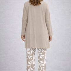 Elegant three-piece trouser set from THE WHITMORE FAMILY featuring tailored jeans, a stylish top, and matching accessories.
