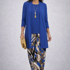 Elegant three-piece trouser set by THE WHITMORE FAMILY featuring a stylish blazer, trousers, and top in sophisticated design.