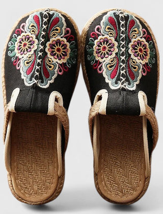 White Marousse™ handmade floral mules by THE WHITMORE FAMILY, featuring comfortable design and intricate floral details.