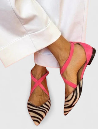 Elegant white ballerina shoe with straps from THE WHITMORE FAMILY's Grace collection, featuring a sleek and stylish design.