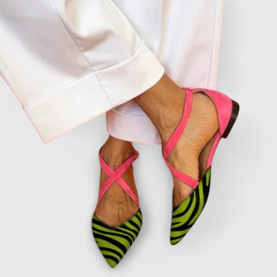 Elegant white ballerina shoe with straps from THE WHITMORE FAMILY's Grace collection, featuring a sleek, stylish design.