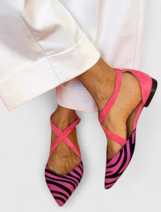 Elegant white ballerina shoe with straps from THE WHITMORE FAMILY's Grace collection, featuring a sleek, stylish design.