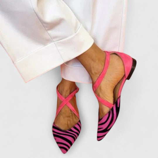 Elegant white ballerina shoe with straps from THE WHITMORE FAMILY's Grace collection, featuring a sleek, stylish design.