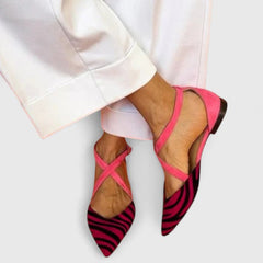 Elegant white ballerina shoe with straps by THE WHITMORE FAMILY, showcasing a sleek design and comfortable fit.