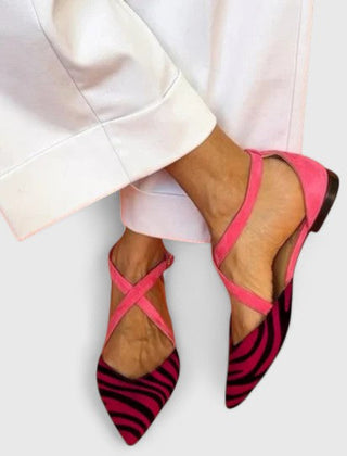 Elegant white ballerina shoe with straps by THE WHITMORE FAMILY, showcasing a sleek design and comfortable fit.