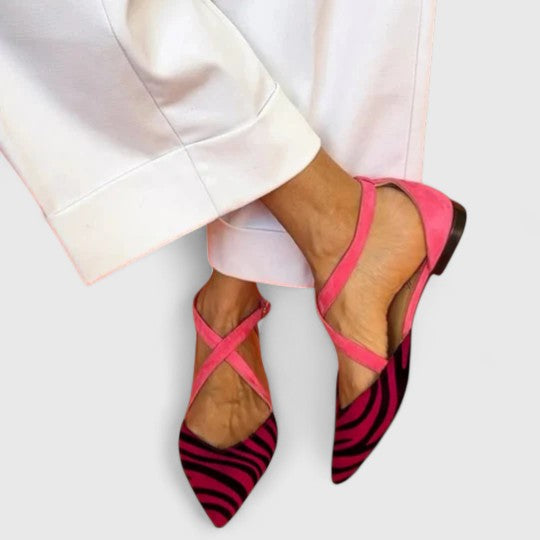 Elegant white ballerina shoe with straps by THE WHITMORE FAMILY, showcasing a sleek design and comfortable fit.