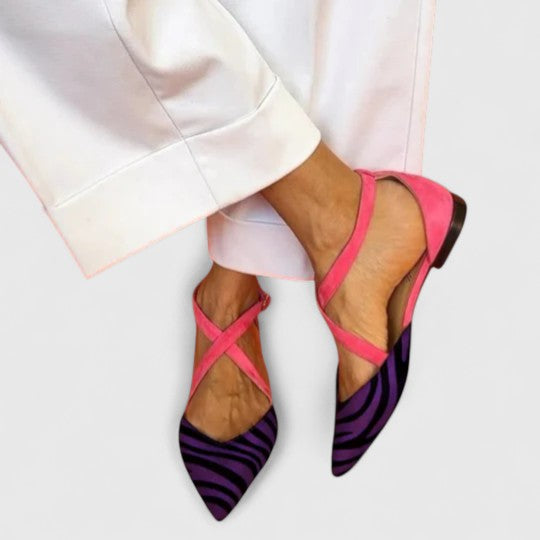 Elegant white ballerina shoe with straps from THE WHITMORE FAMILY's Grace collection, showcasing a stylish, comfortable design.