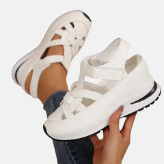 White Aveta™ orthopedic sandals by THE WHITMORE FAMILY featuring supportive straps and cushioned soles for comfort.